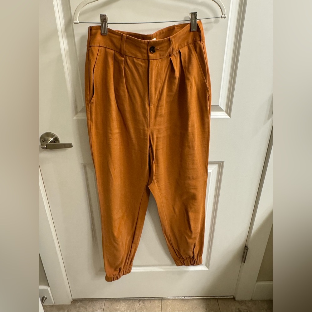 A Loves A paper bag trousers size 4 burnt orange in color